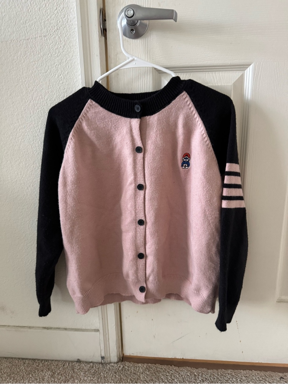 Pink and navy cardigan sweater